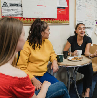 Women drinking coffee and talking