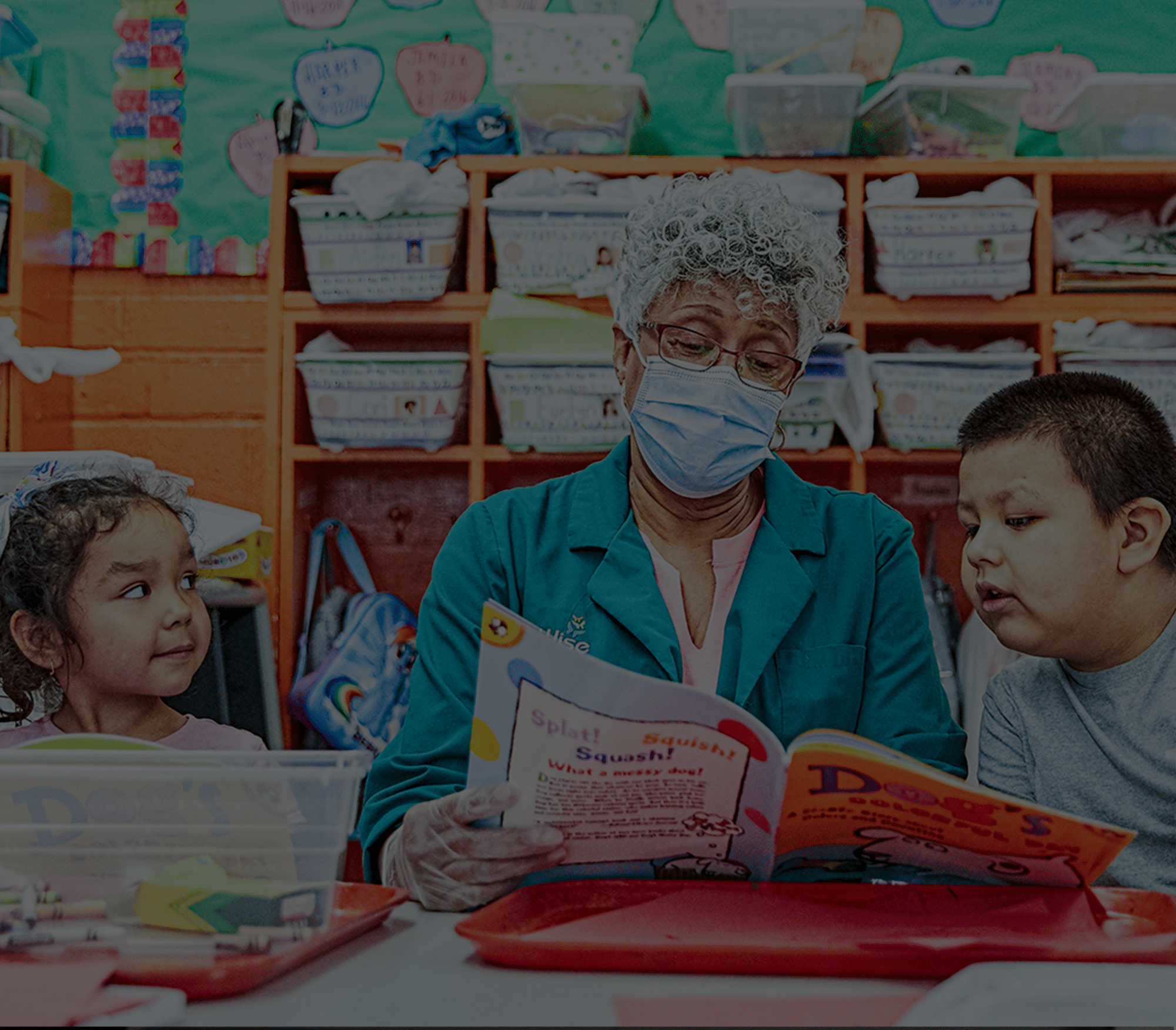 United Way is committed to diversity, equity and inclusion. This image shows an older woman reading to two children. 