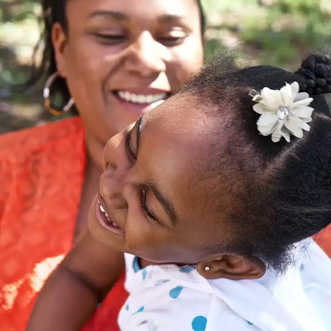 A woman and child play