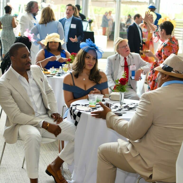 People attend the Run for the Roses Derby party
