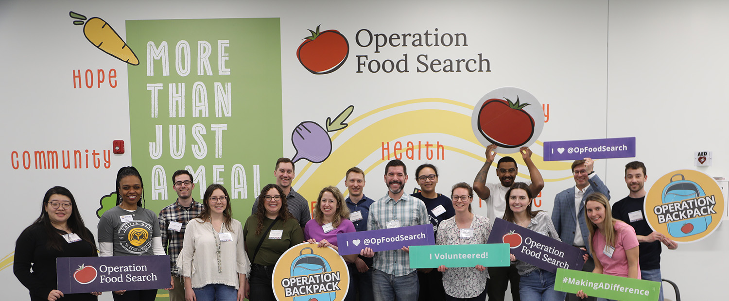 Members of United Young Leader members standing in front of a mural from Operation Food Search